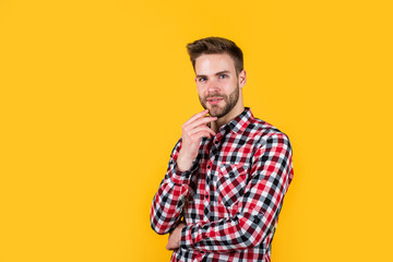 Autumn style. confident and calm. handsome casual man standing with beard and bristle. cheerful and stylish. handsome man on red background. indoor portrait of sexy european businessman. copy space