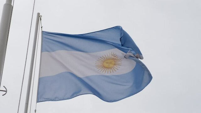 Argentine flag waving in the wind at slow motion. National symbol of Argentina, American nation. South America emblem. State, sign, patriotic. Waving Argentina flag.