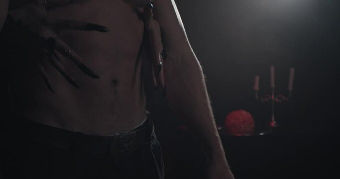 Close up of the mans abs and womans hands touching him, creepy candlestick, 4k
