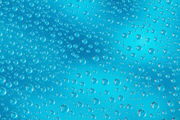 Water drops on blue background. Top view. Closeup.