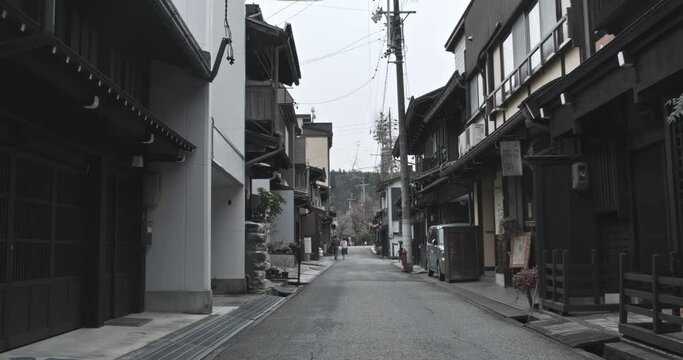 Walking traditional historic Japanese empty street with cozy houses. Steady POV walking, Takayama, Japan.