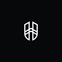 Minimal elegant monogram art logo. Outstanding professional trendy awesome artistic H HU UH initial based Alphabet icon logo. Premium Business logo white color on black background