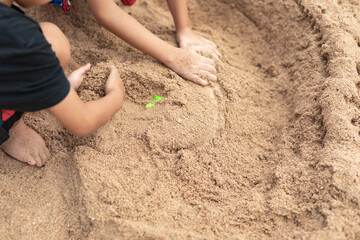 girl playing with sand