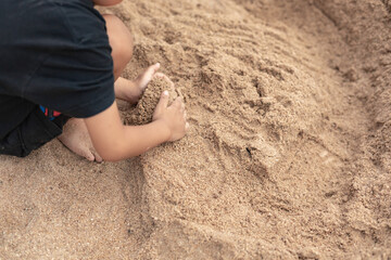 child playing on the beach