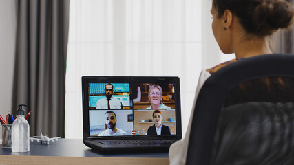 Female freelancer in a video conference with business partners.