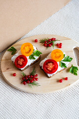 sandwiches with tomato herbs and berries