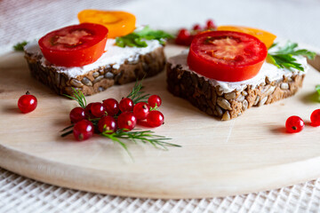 sandwiches with tomato herbs and berries