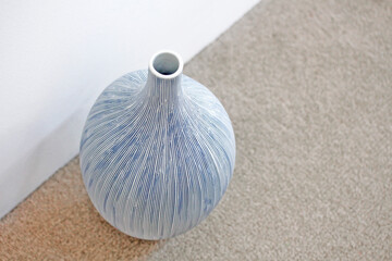 ceramic vase on the carpet