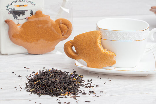 Cookies with black tea on the background