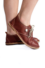 Ladies brown leather vintage shoes isolated close-up