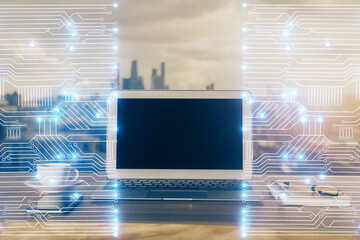 Computer on desktop in office with technology theme hologram. Multi exposure. Tech concept.