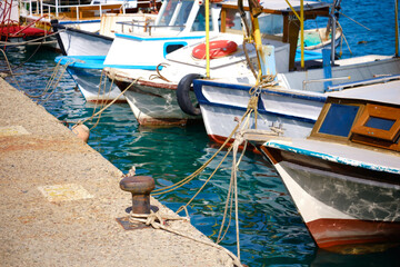 Fototapeta na wymiar Mooring bollard and moored boats at marina