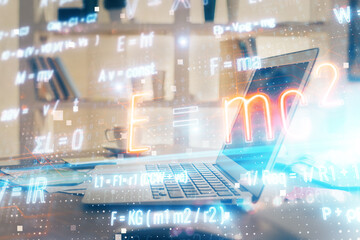 Desktop computer background and formula hologram writing. Double exposure. Education concept.