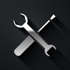 Silver Screwdriver and wrench spanner tools icon isolated on black background. Service tool symbol. Long shadow style. Vector Illustration.
