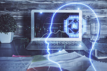 Double exposure of table with computer and brain hologram. Data innovation concept.