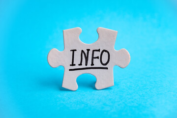 Puzzle piece with INFO text it stands on a bright blue background. Symbol of association and connection, business strategy, completing, team support and help concept. Conceptual. front view