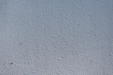 Close-up - gray-brown stone wall in the old facade of the house