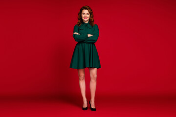 Full length body size view of her she nice-looking attractive lovable charming pretty cheerful cheery wavy-haired girl folded arms isolated on red maroon burgundy marsala color background