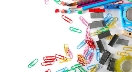 Scattered school, office supplies, staple strips, pens, paperclips, tape isolated on white background, top view