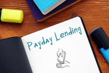 Business concept about Payday Lending with inscription on the sheet.