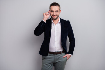 Portrait of his he nice attractive cheerful content successful mature man specialist wearing elegant look touching specs posing isolated over light gray pastel color background