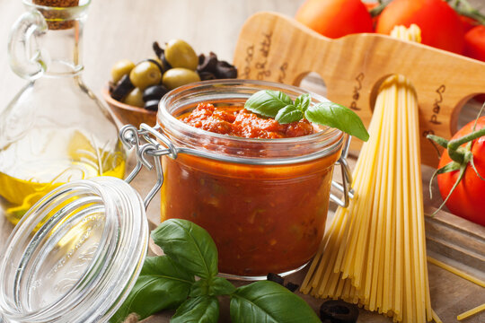 Ingredients for spaghetti with tomato sauce on wooden background. Italian healthy food background.