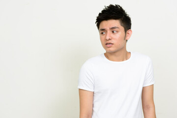 Obraz premium Portrait of stressed young Asian man looking disgusted