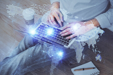 Media network theme hologram with man working on computer on background. Concept of internet communication. Double exposure.