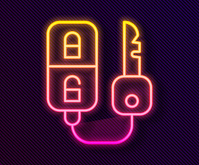 Glowing neon line Car key with remote icon isolated on black background. Car key and alarm system. Vector Illustration.