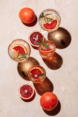 Summer cocktail with blood orange, grapefruit and rosemary