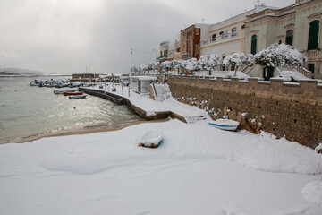 Ionian coast after a exceptional snowfall, Salento, Italy