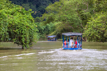 Tourists on the boat are going to enjoy beautiful natural scenery lake of Ba Be National Park at Bac Kan, Northern Vietnam.