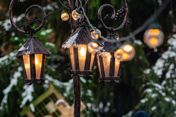 Medieval lanterns with spruce branches at Christmas market. Riga, Latvia
