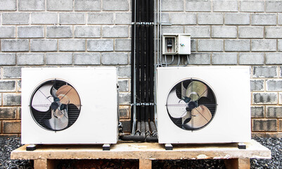 Air conditioning compressor on wall.
