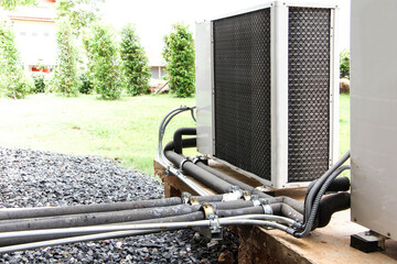 Air conditioning compressor on wall.