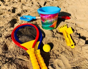 Vacation image of children's beach toys on the sand