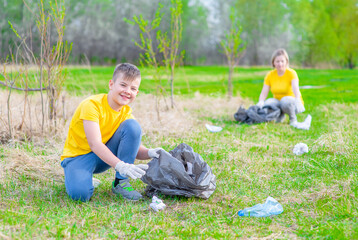 Volunteers clear the park from garbage. Volunteer and ecology concept