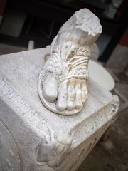 Foto op Canvas GIRONA SPAIN-JUNE 27, 2020: Statue of Saint Narcis’ foot at the Carrer de les Mosques (Street of Flies). Close up view from above. © Belogorodov