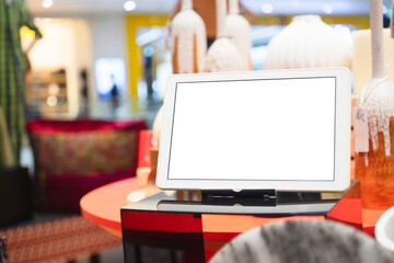 Mockup blank white screen tablet on table for your adverstisement text or artwork.