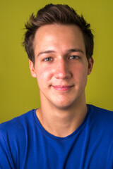 Fototapeta premium Face of young handsome man looking at camera