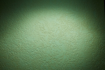 Cloud of light green light on a dark background structural background