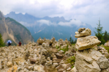 Stone tower made by tourists in mountains.