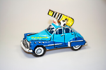 Paper car model - veteran. Souvenir from a holiday in Havna
