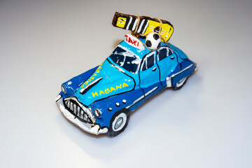 Paper car model - veteran. Souvenir from a holiday in Havna
