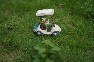 Fototapeta premium golf cart on the green grass