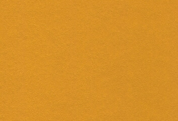 Close up view of textured golden creative paper background.