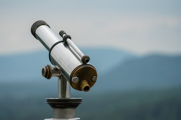 Telescope in front of big mountains