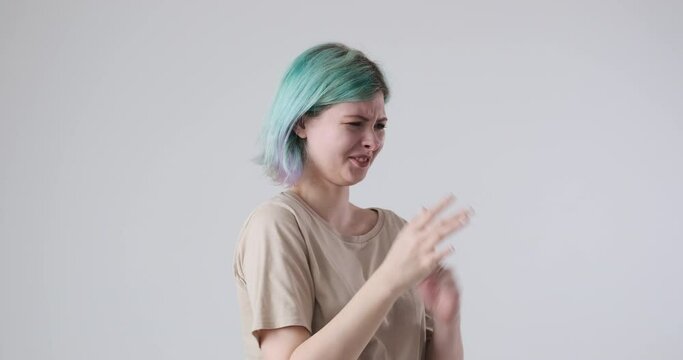 Disgusted woman pinching nose to avoid bad smell expressing repulsive emotion
