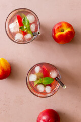 Fototapeta na wymiar Cold peach tea with mint. Cold drinks. Healthy eating. Vegetarian food.