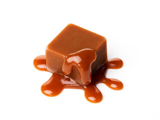 A melting piece of milk chocolate on a white background